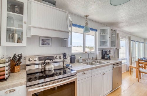 Bayshore House | Bright, Open, Updated Single-Level Oceanfront Home Right on Beach with Game Room