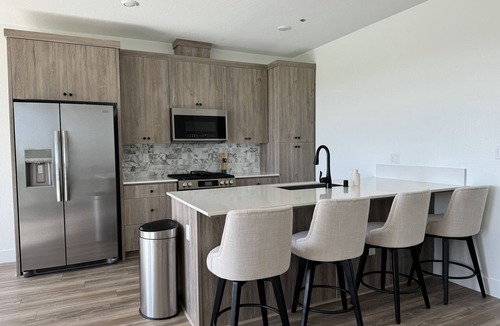 Clovis House | Charming 2-bedroom townhome with garage, pool access, & all utilities included.
