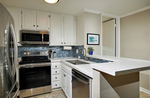 Townsite Condo | Coastal One-Bedroom Haven with Ocean Peeks and Serene Gardens