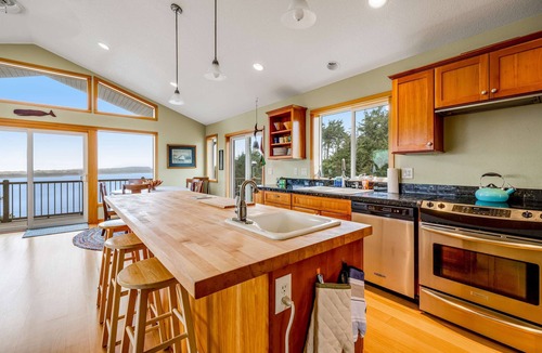 Cape Meares House | Lakefront escape with water views grill wrap around deck walk to beach