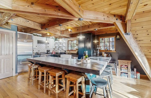 Serene Lakes House | Luxury lakefront home with private hot tub, on-site dock, fireplace & HOA beach