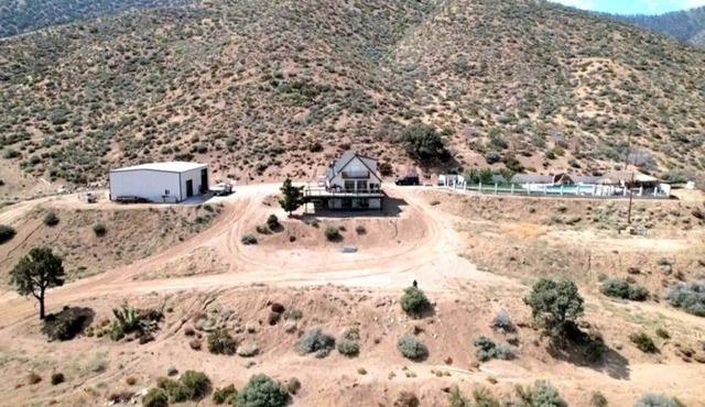 A slice of paradise nestled on 32 acres of pristine desert in Lucerne Valley.