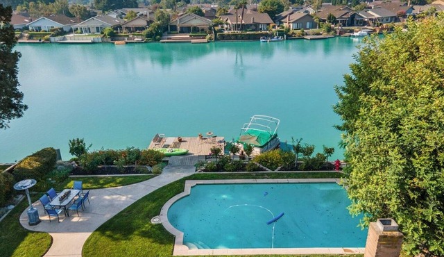 Cozy Home on a Lake and a sparkling pool with lush garden and Dock!