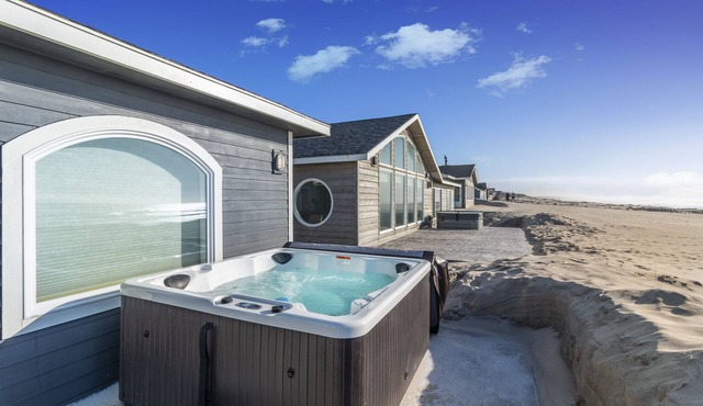 Enjoy surf or sunset in the Hot Tub at this Beachfront Home in a Gated Community