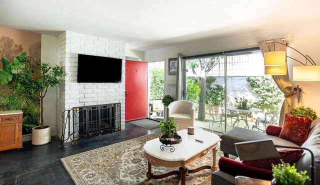 Newly remodeled, uniquely styled property surrounded by botanical-like garden setting.