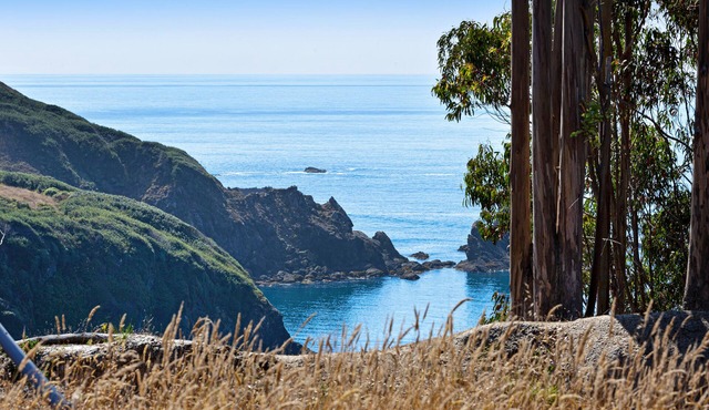 Ocean view home with free WiFi, private hot tub, furnished deck, & gas grill