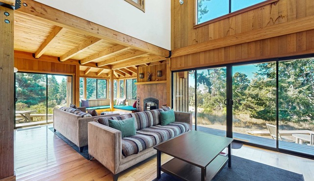 Ocean-view lodge with private hot tub among coastal pines