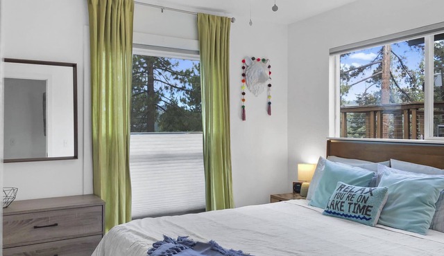 Relax and Unwind with a Lake View Snow-dusted trees and lake views await you!