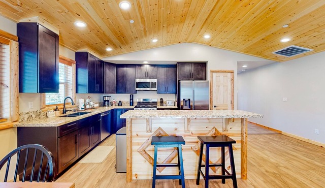 Wilderness stay with enclosed yard, hammock, grill, game tables, & fireplace